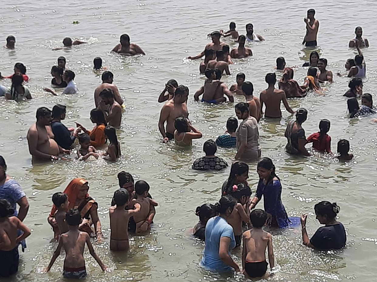 Devotees take a dip of faith in the Ganges on Ashadh Amavasya