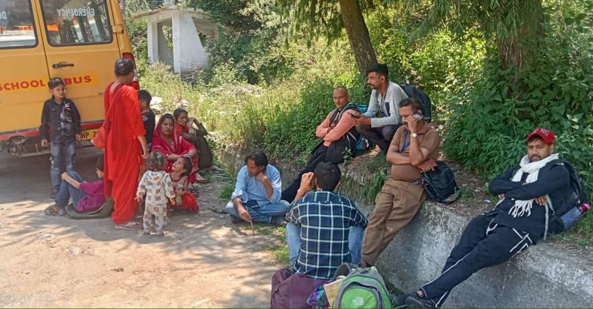 Government buses gasped in the middle of the road, passengers kept wandering