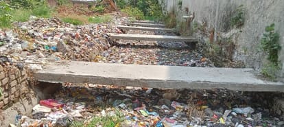 Monsoon may knock on 28 but the city's major drains are not yet clean