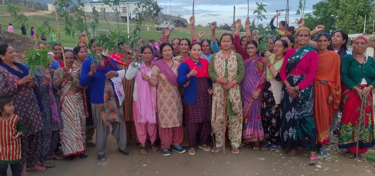 Poles and scorpion grass raised in hands for the prevention of illegal liquor