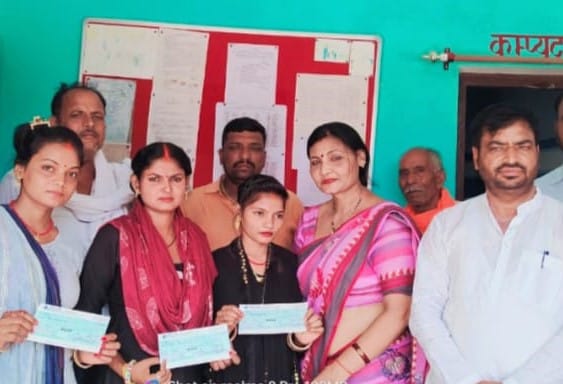 Checks distributed to the beneficiaries of mass marriage