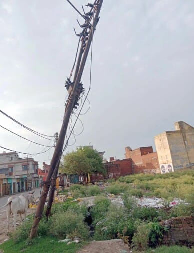 danger of accident due to bent electric pole