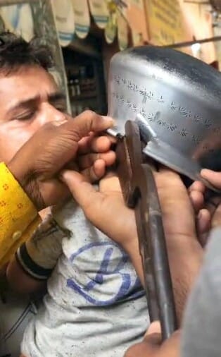 Bottle stuck in child's head, mechanic cut it out