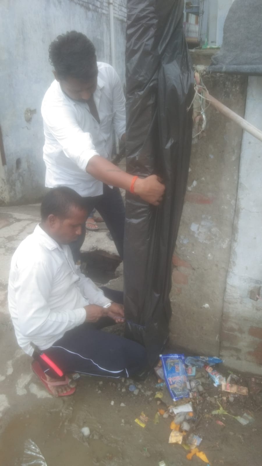 Polythene tied on poles to protect Kanwariyas from electrocution