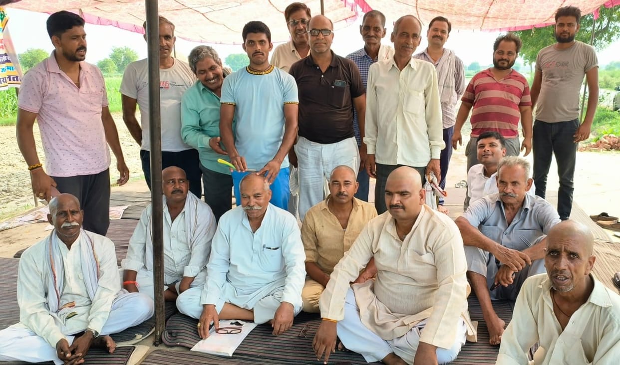 Shaved and sat on the dharna site