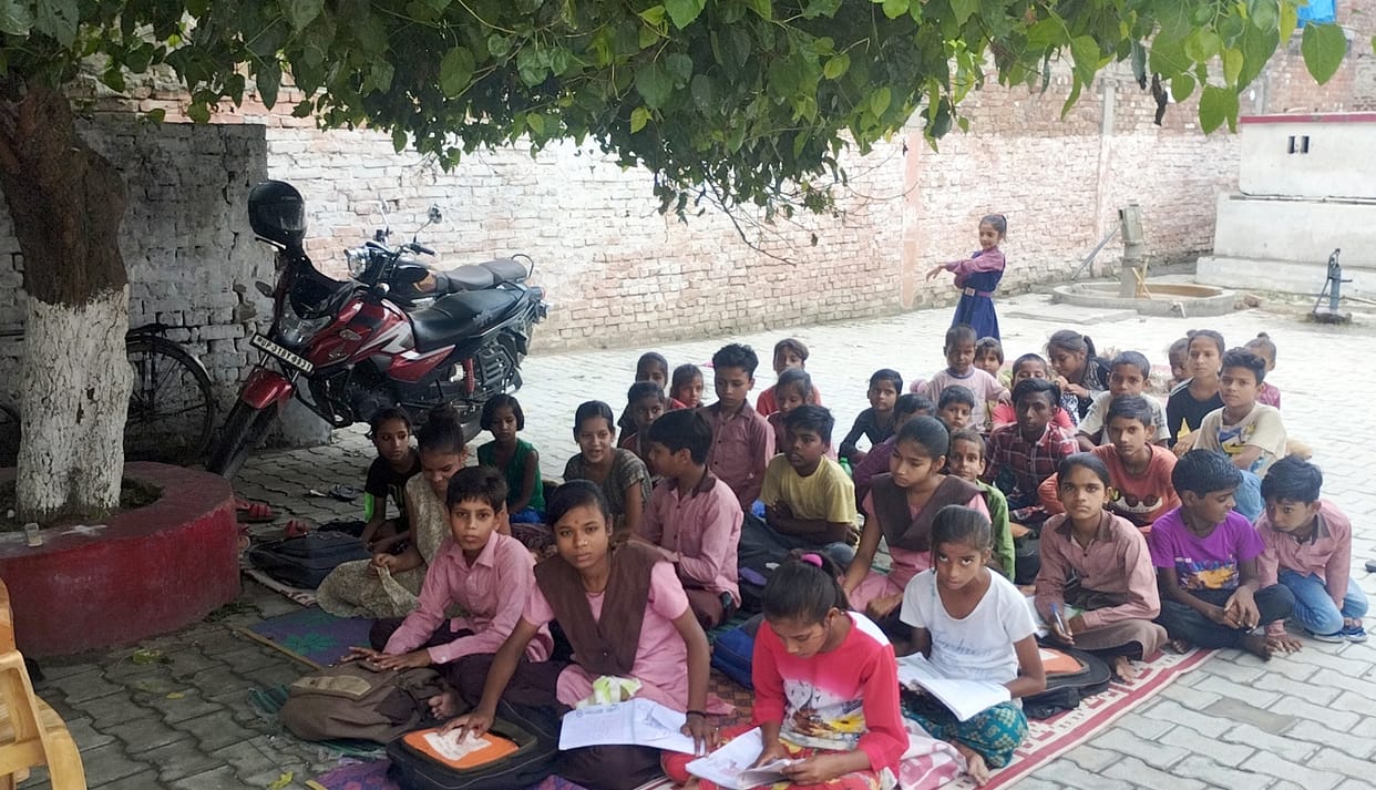 The condition of council schools: Somewhere under a tree, somewhere else, studying sitting on sackcloth