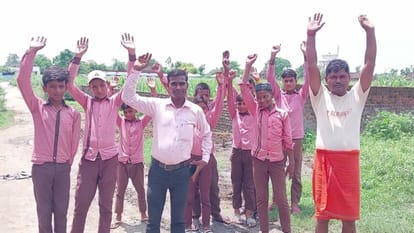 Children on the road to protest against water logging on the way to school