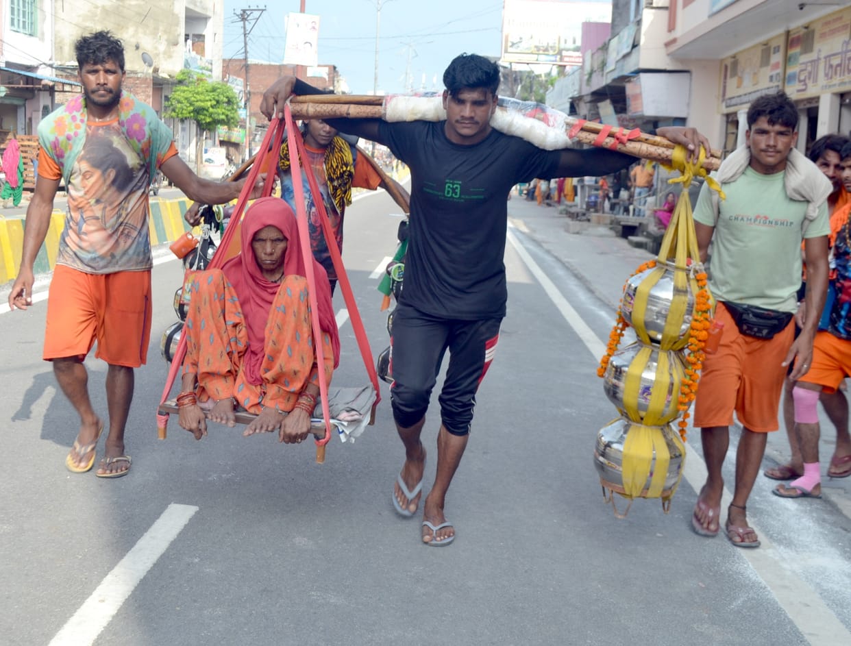 Son carrying water equal to mother and her weight