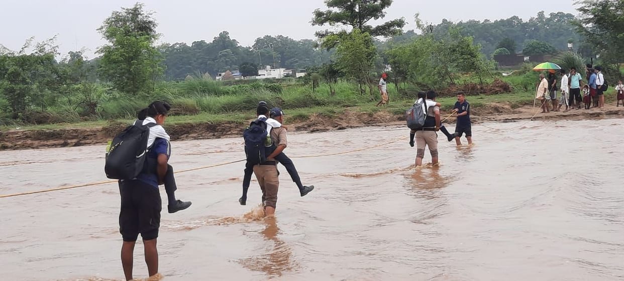 Made children cross the river by sitting on their back