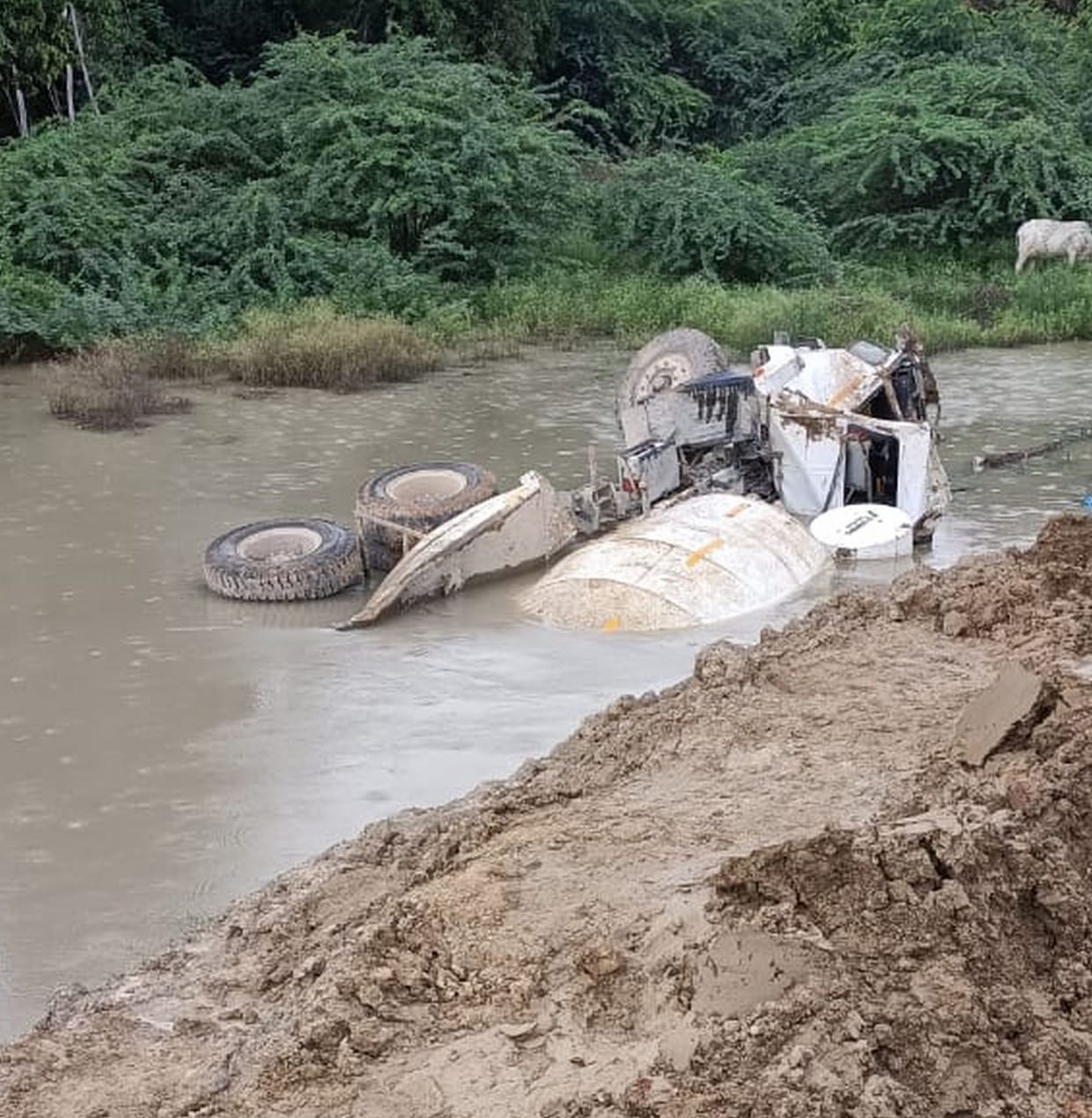 Dumper fell into boat canal due to mud subsidence