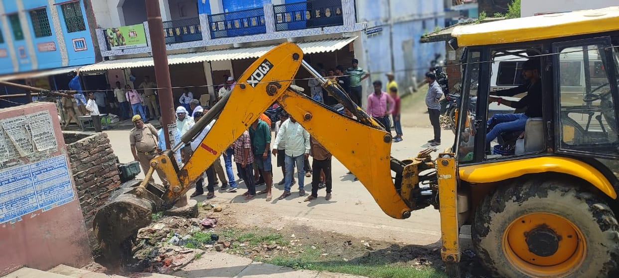 Bulldozer running on encroachment, open way