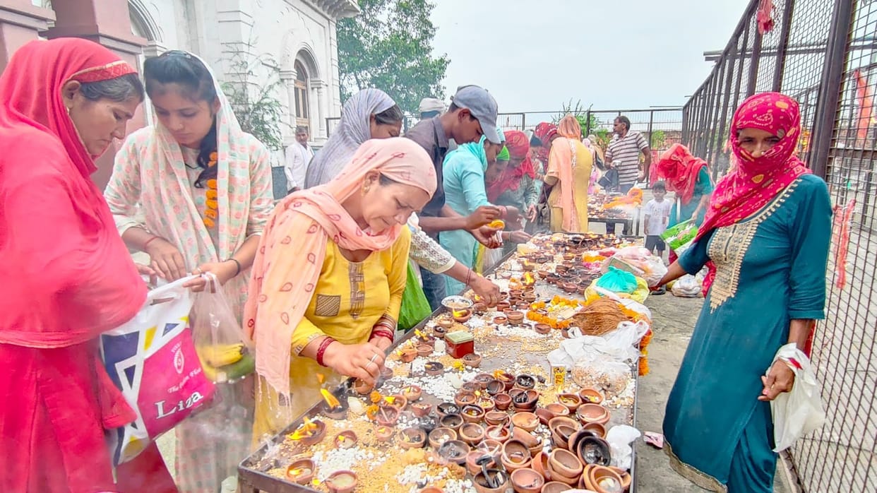 Crowd of devotees gathered on Ashtami, lamps of faith lit
