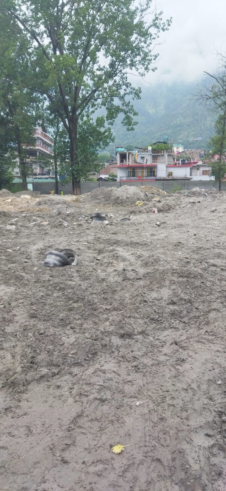 Debris dump on parking lot in vegetable market Bhuntar,