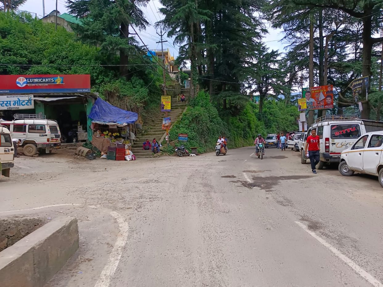 Water flowing on the road due to lack of drain on NH side