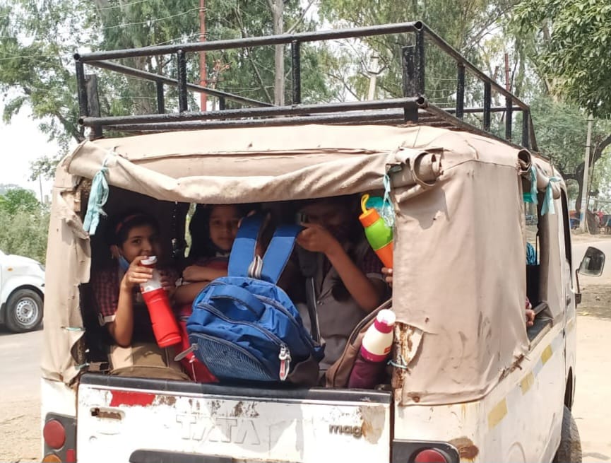 School vehicles running with children like straw