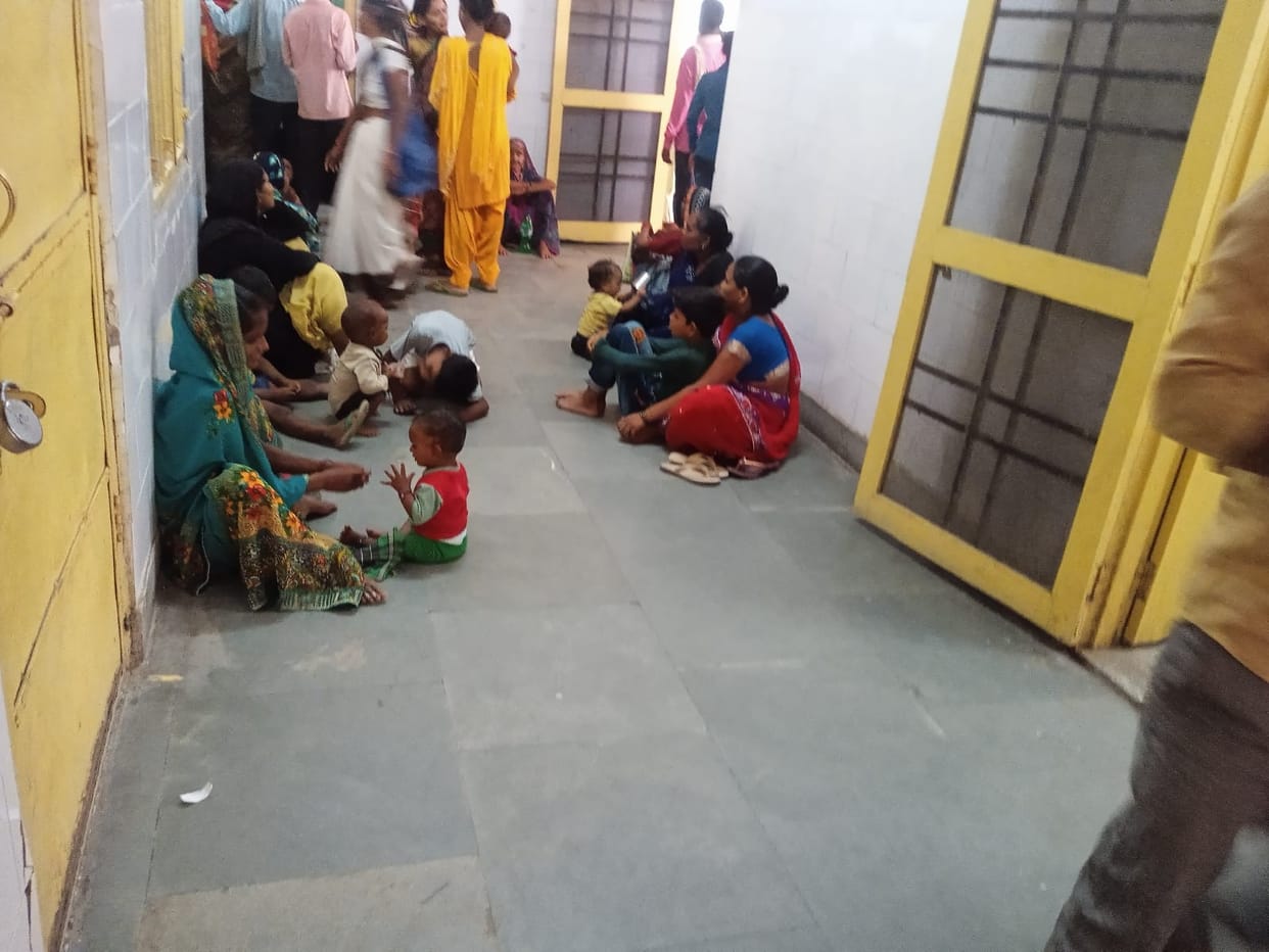 Patients wait for doctor sitting on the floor in CHC
