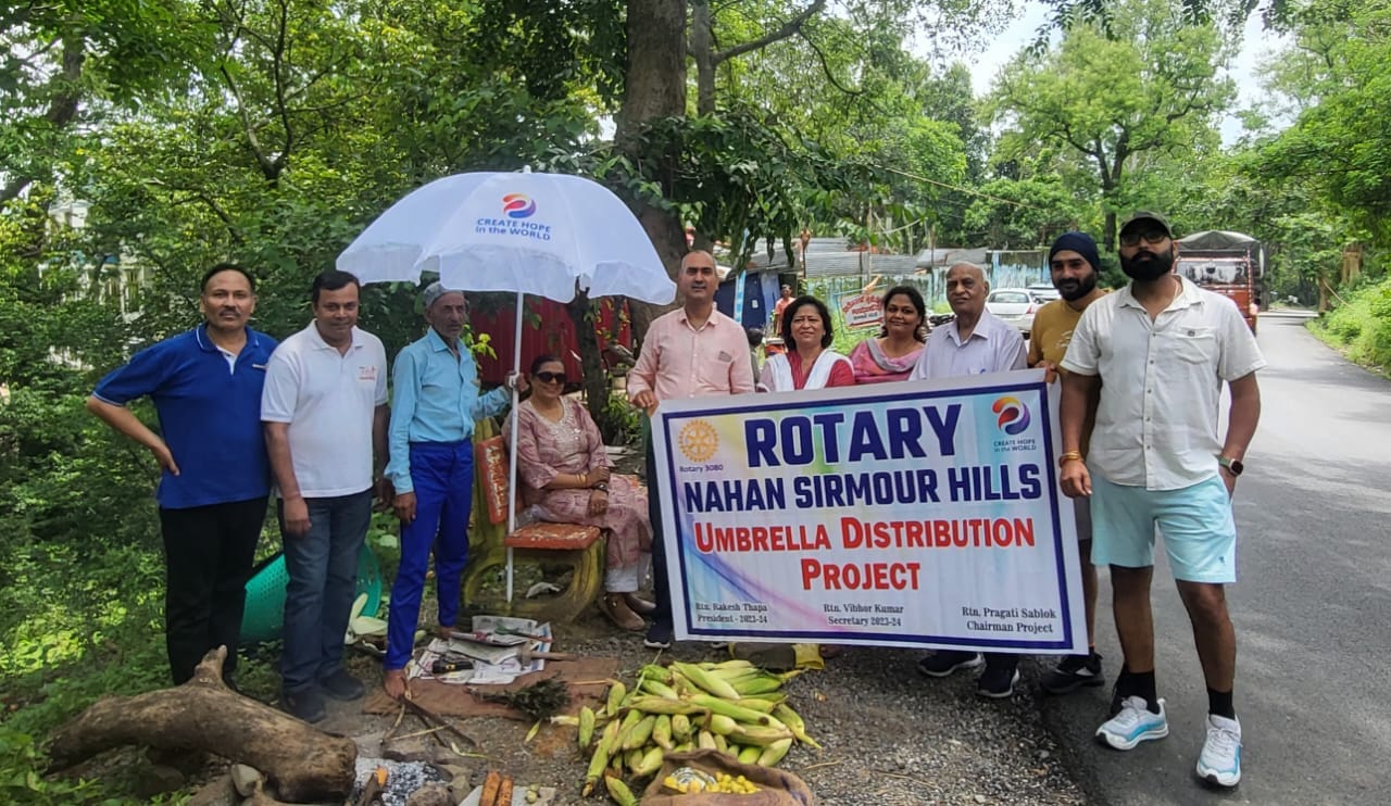 rotary distributed umbrellas to rehdi and fadi owners