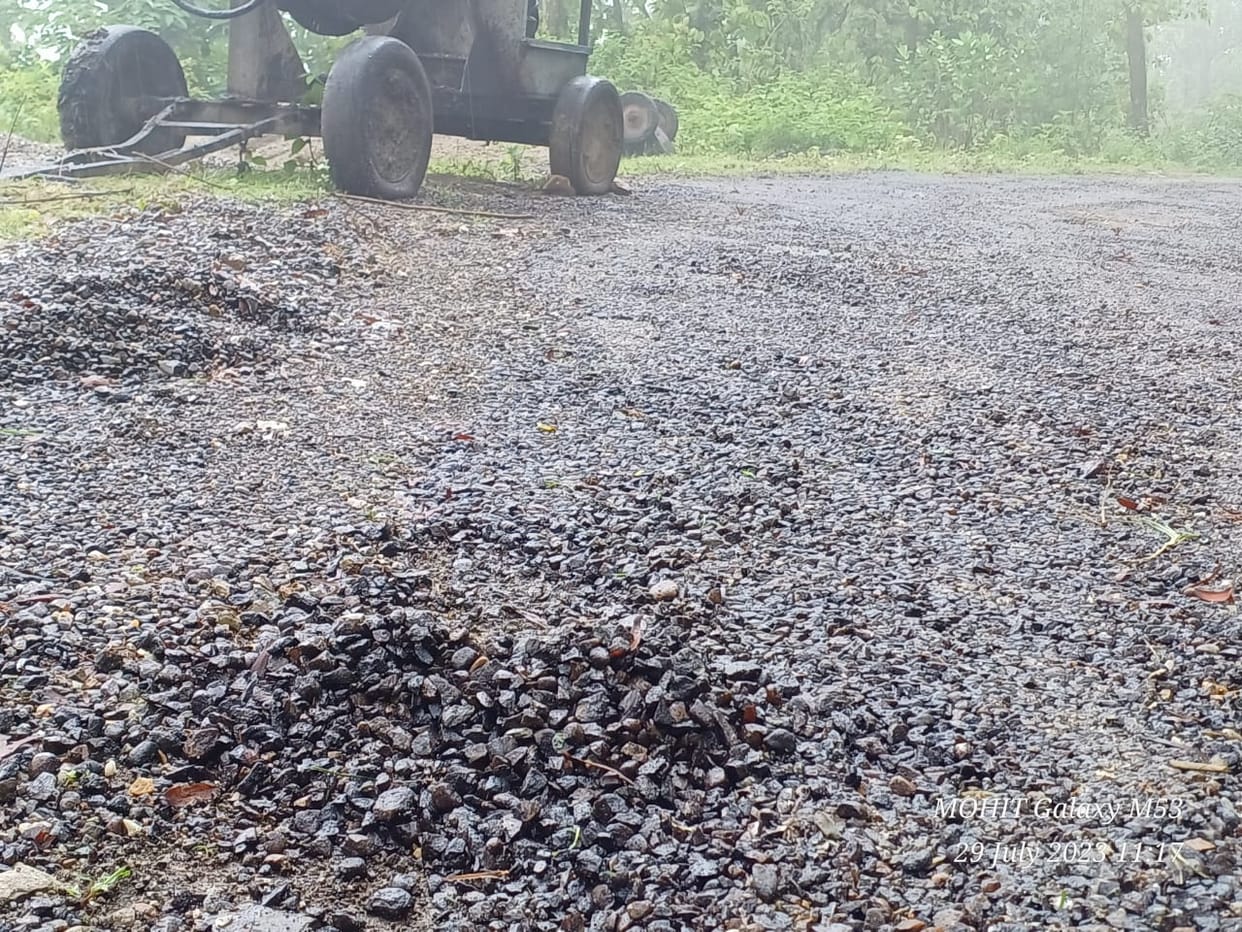 Road being built, asphalt crumbling