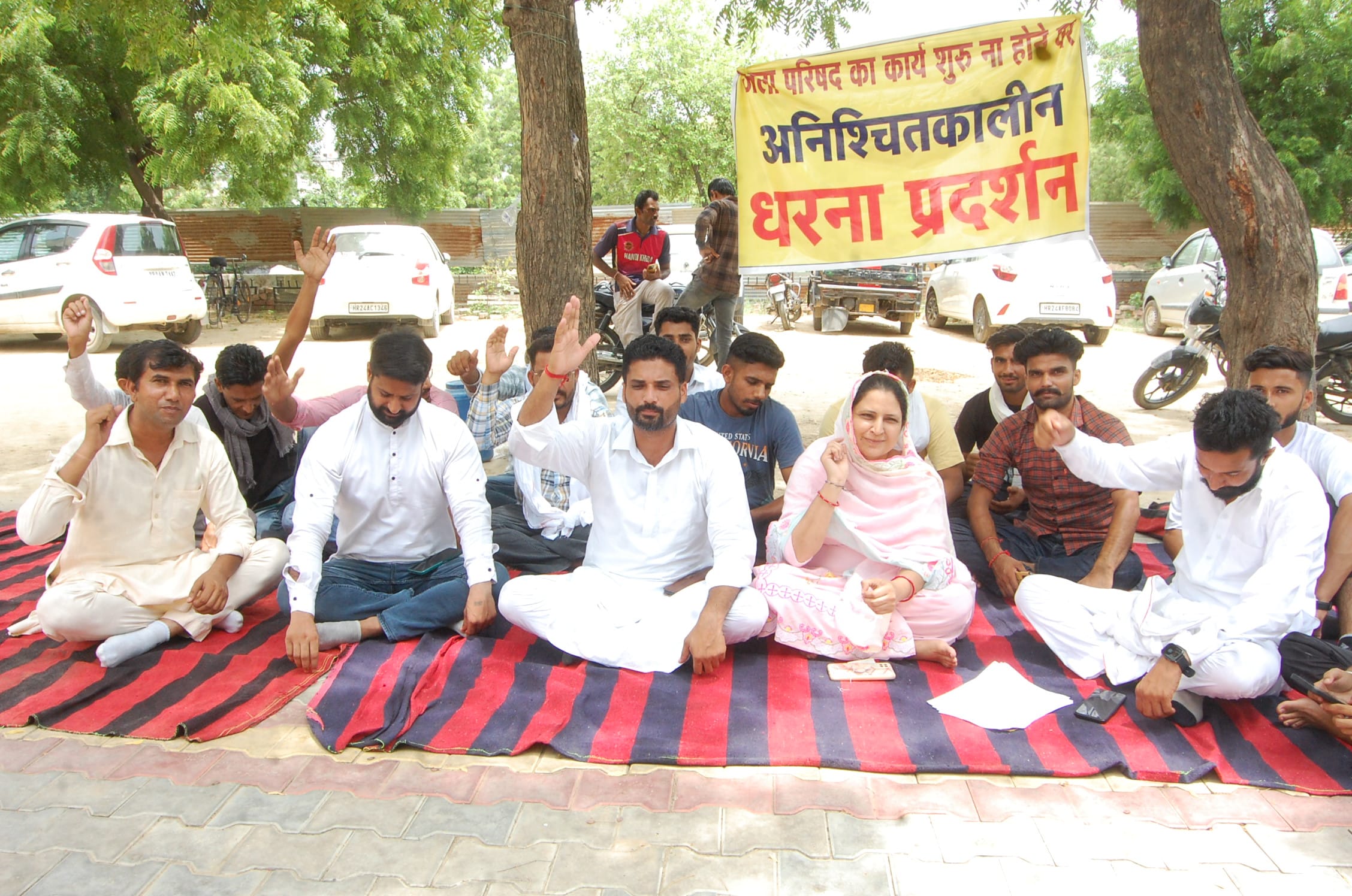 District Councilor sat on dharna with supporters due to lack of development work