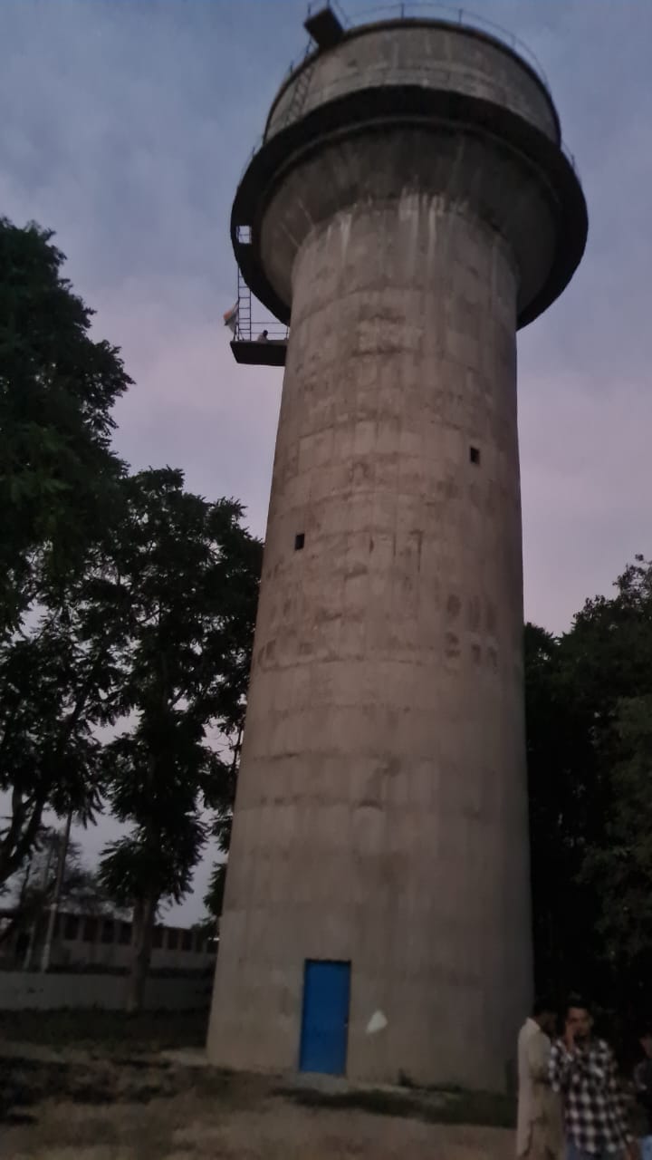 Two farmers climbed on the water tank in Jamal village for the demand of water