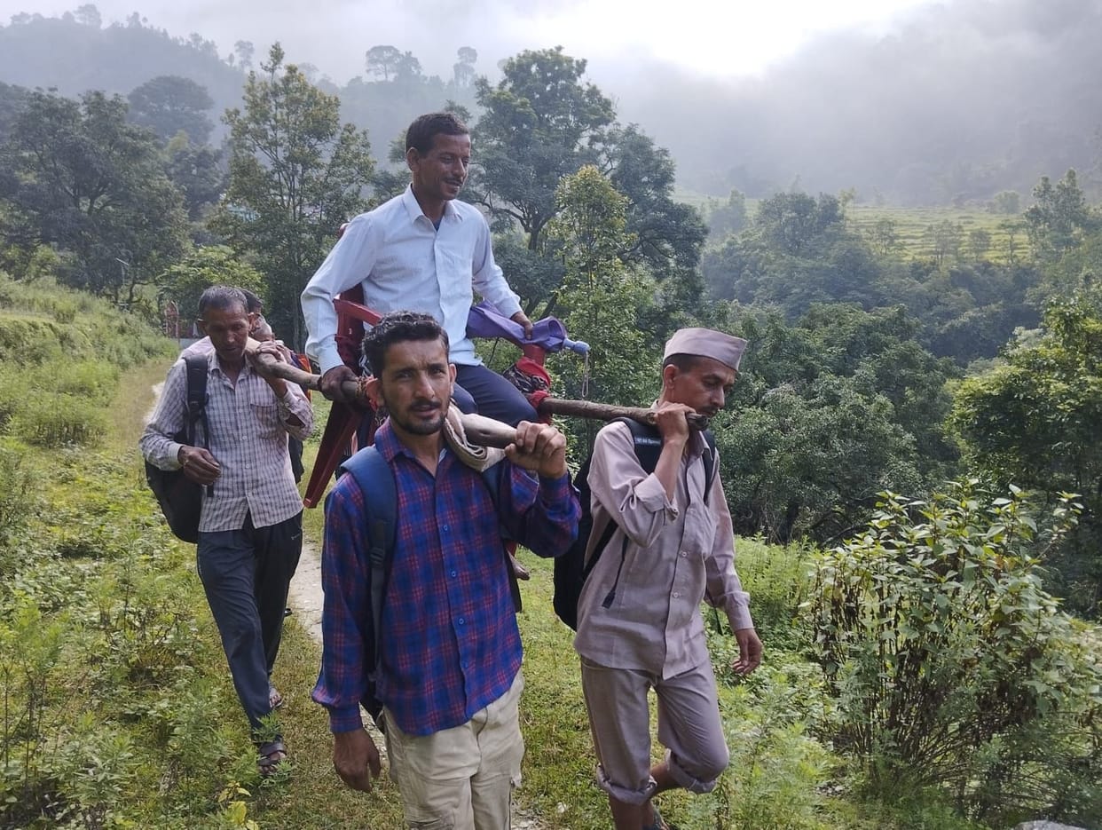 After covering a distance of five km with the help of a dolly, the patient was taken to the road