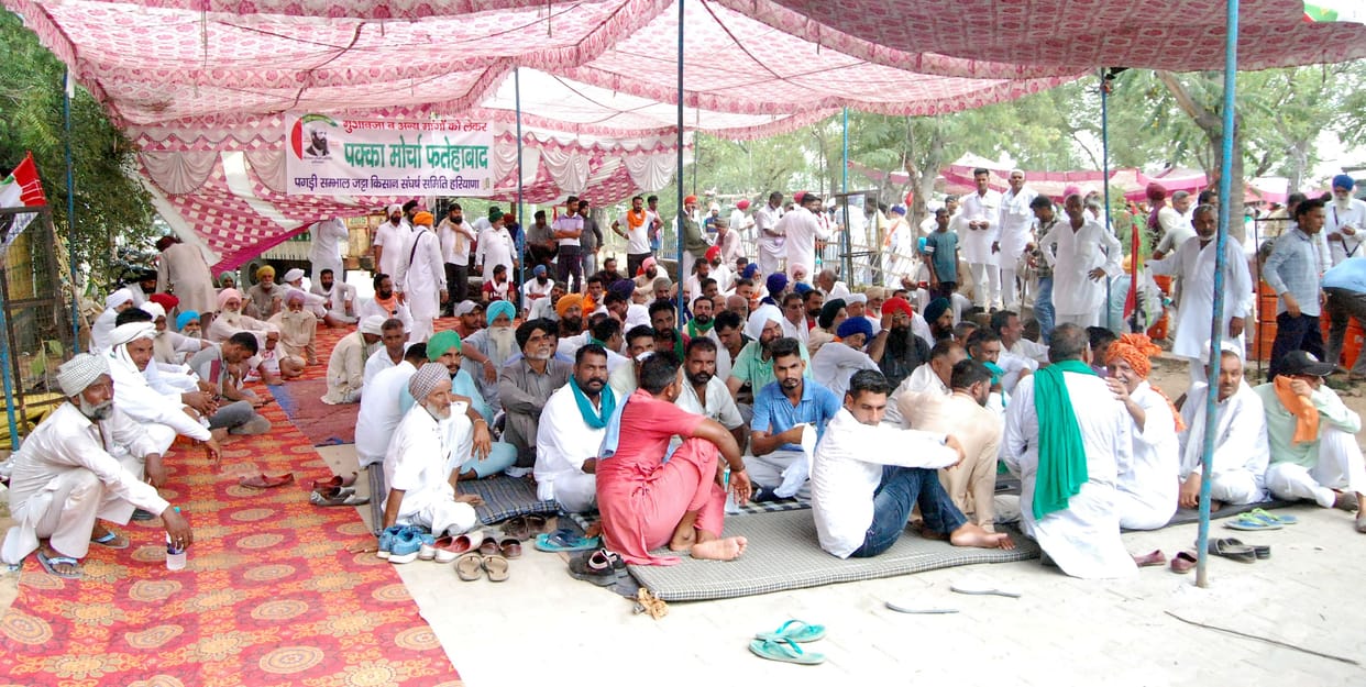 For their rights, the farmers surrounded the small secretariat by placing tractors at the gate