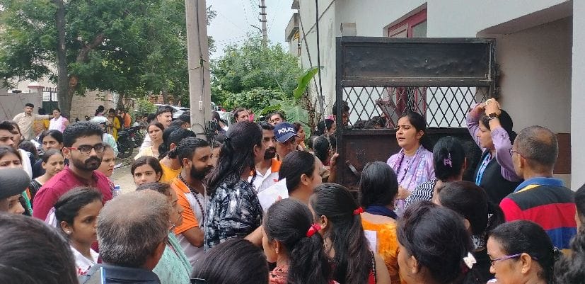 Ornament outside Exam Center, people Protested