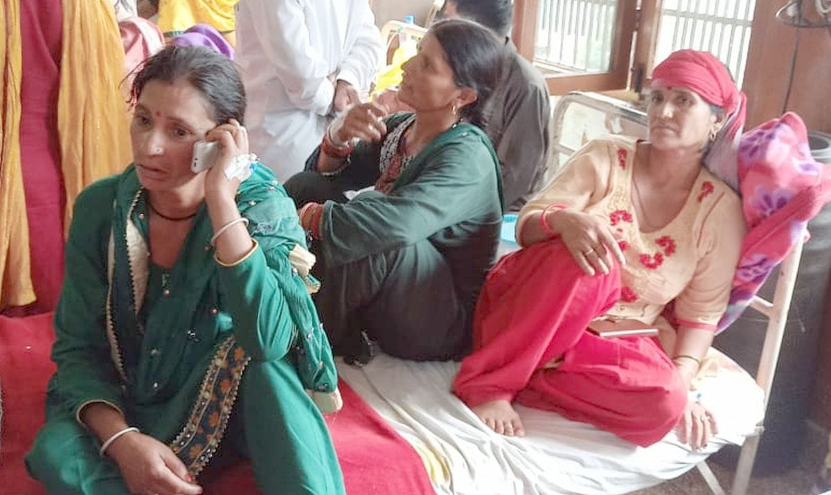 Three patients being treated on one bed