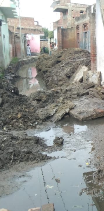 Water filled on the road dug for drainage after the overflow of the pond