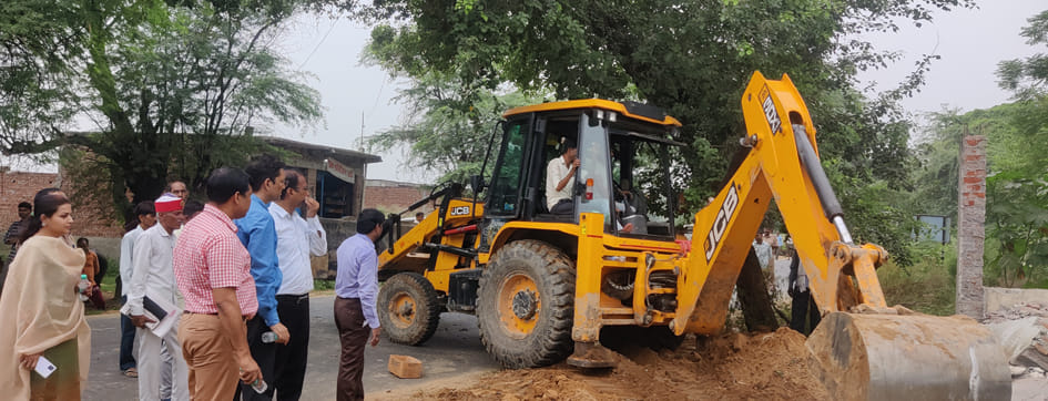 Bulldozer on illegal construction including panchayat building and temple