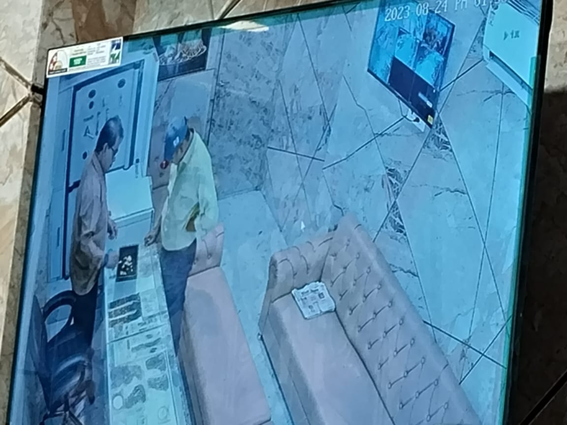 Young man taking jewelry worth lakhs from jewelers showroom