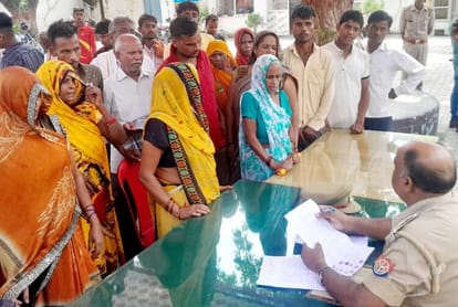 Farmer built dam to save farm, seven dozen houses surrounded by water