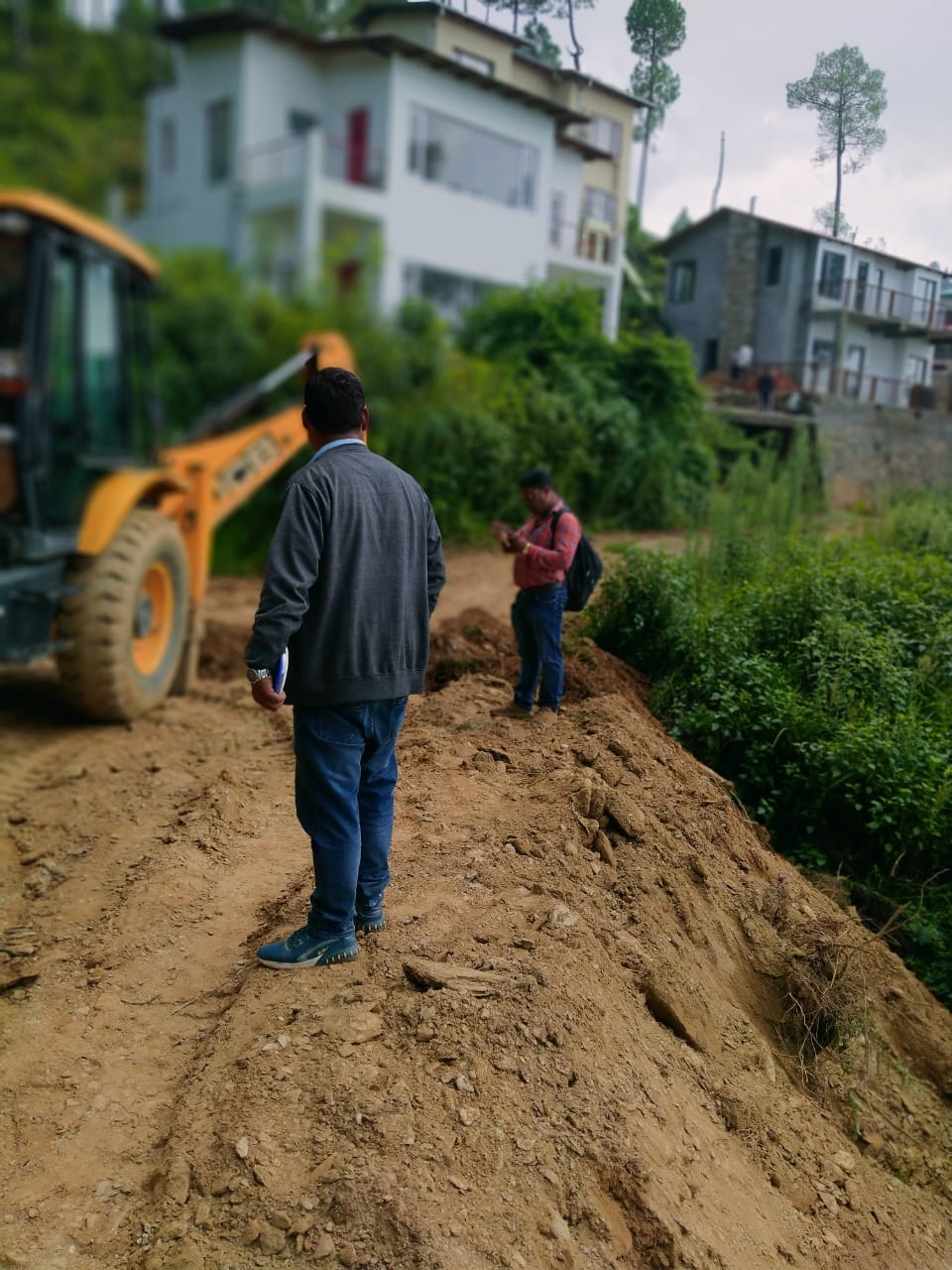 JCB seized for cutting road on Nazul land