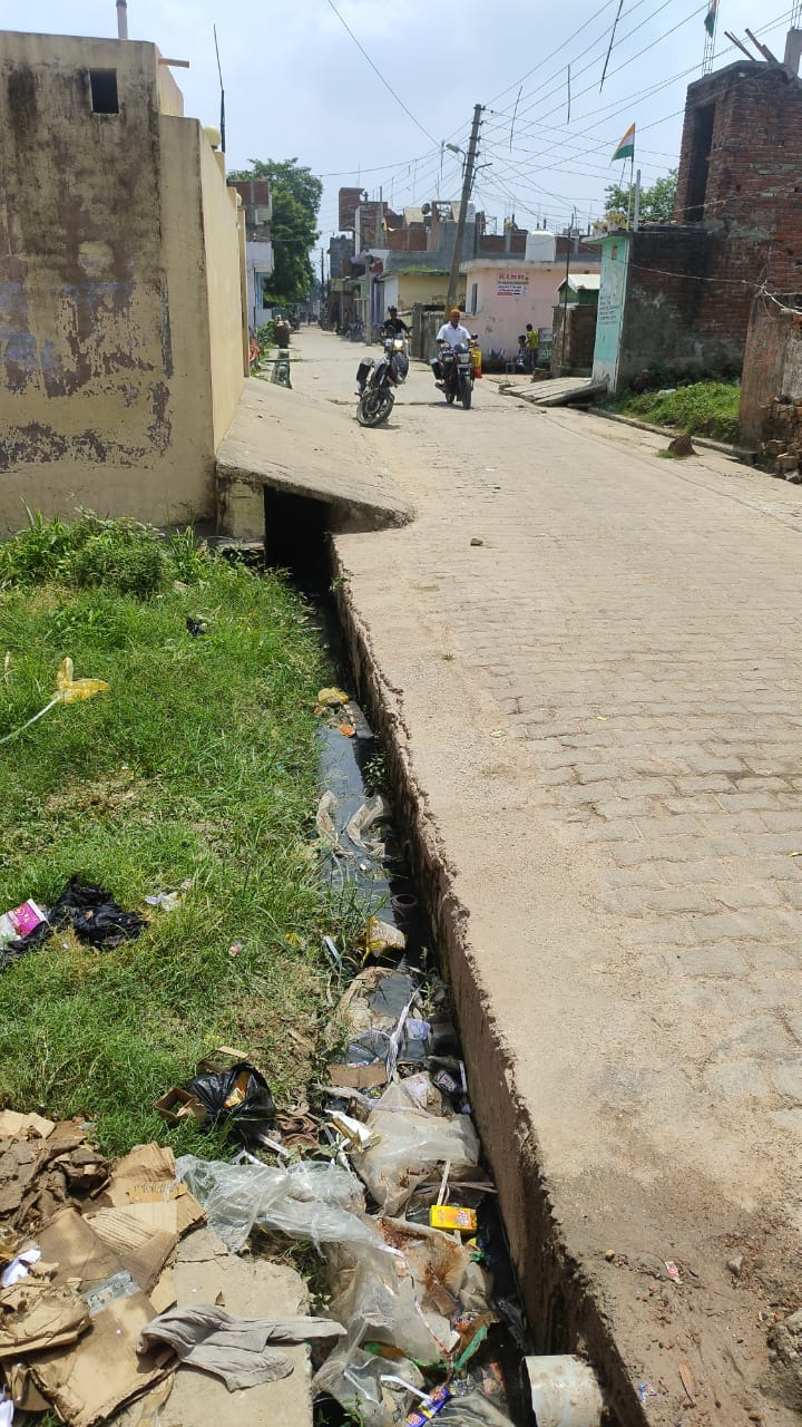 Bad roads and buzzing drains became the identity of the ward