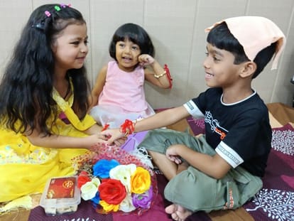 Sisters tie rakhi on brother's wrist in auspicious time