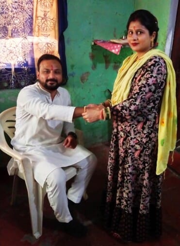 sister tied the thread of love on brother's wrist