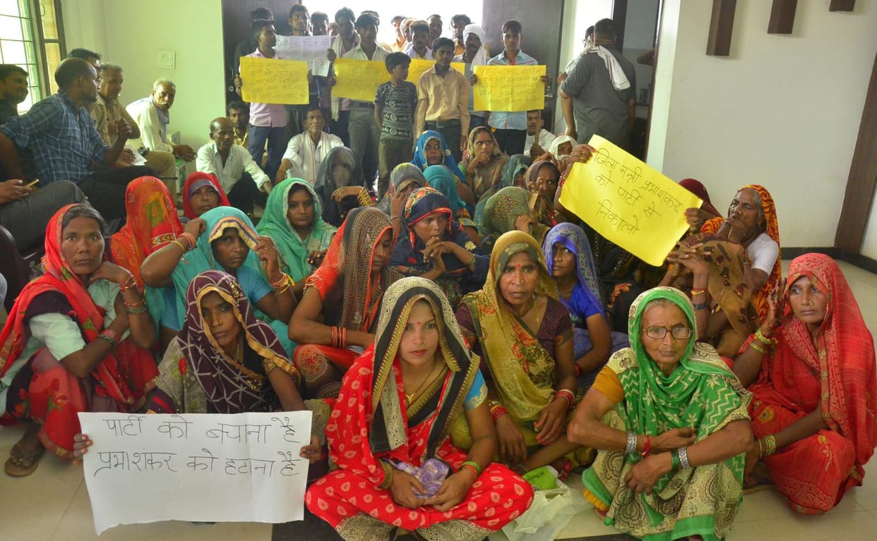 a family protest at BJP office against former district minister in budaun