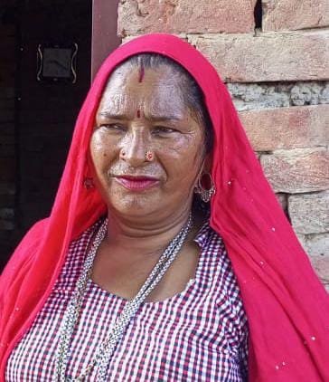 Woman shot dead while sleeping at home
