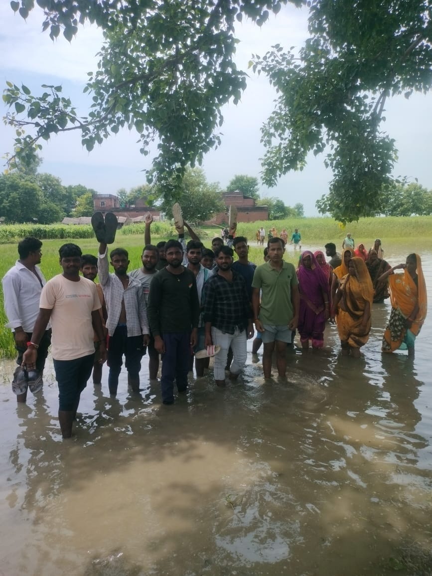 Villagers demonstrated by standing in water on the road
