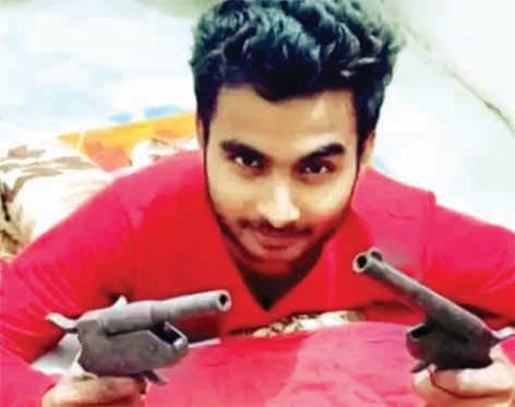 Photo of young man holding weapon in both hands goes viral