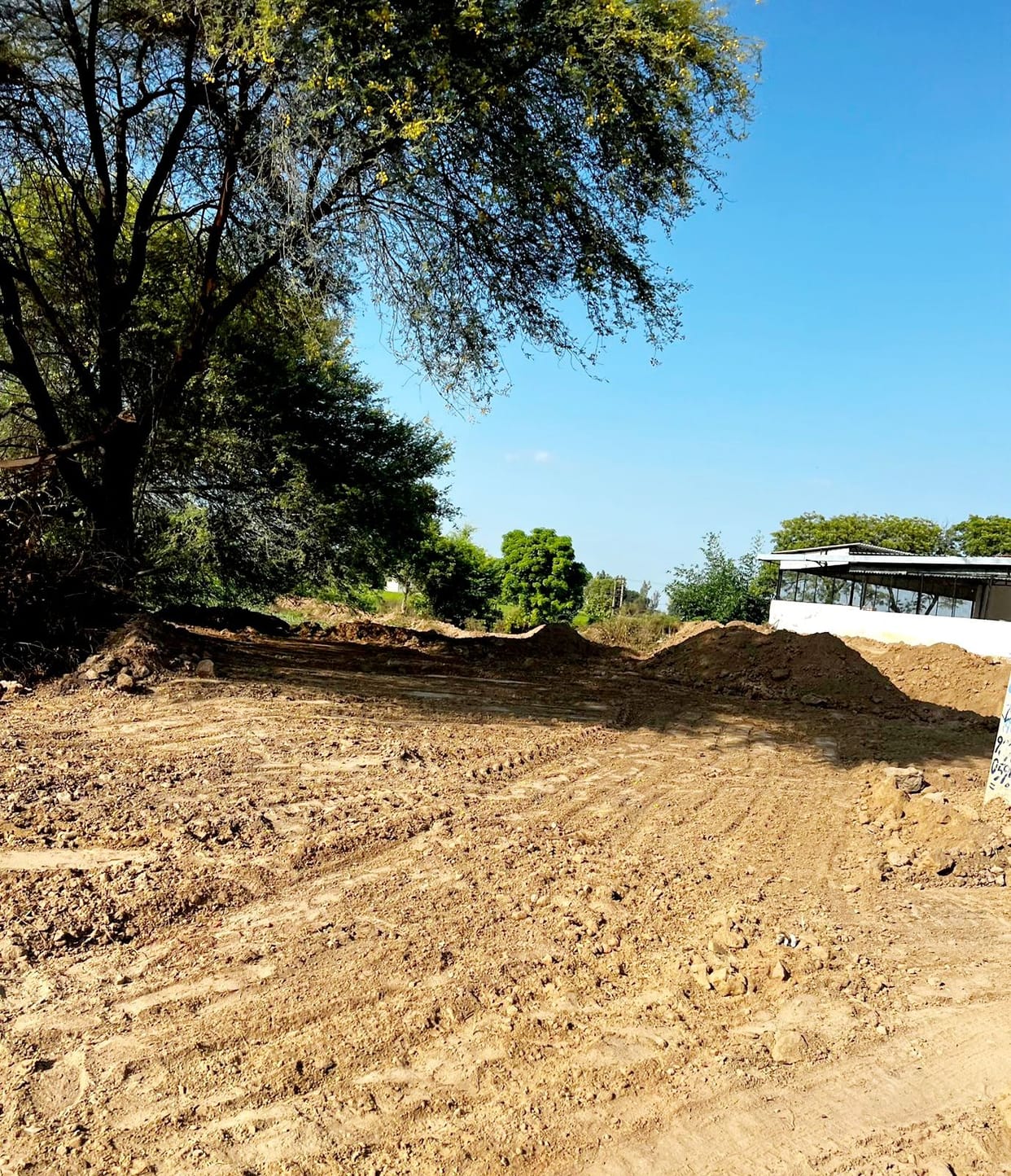 Sarpanch of Bhundra accused of trying to pour soil on drain of dirty water