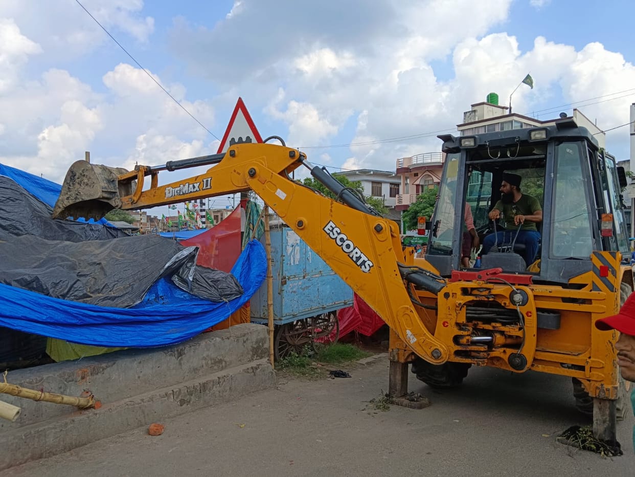 Got the items kept on the footpath removed
