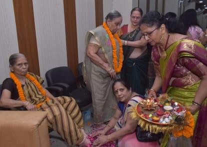 Respected elderly women by washing their feet, also applied sandalwood tilak