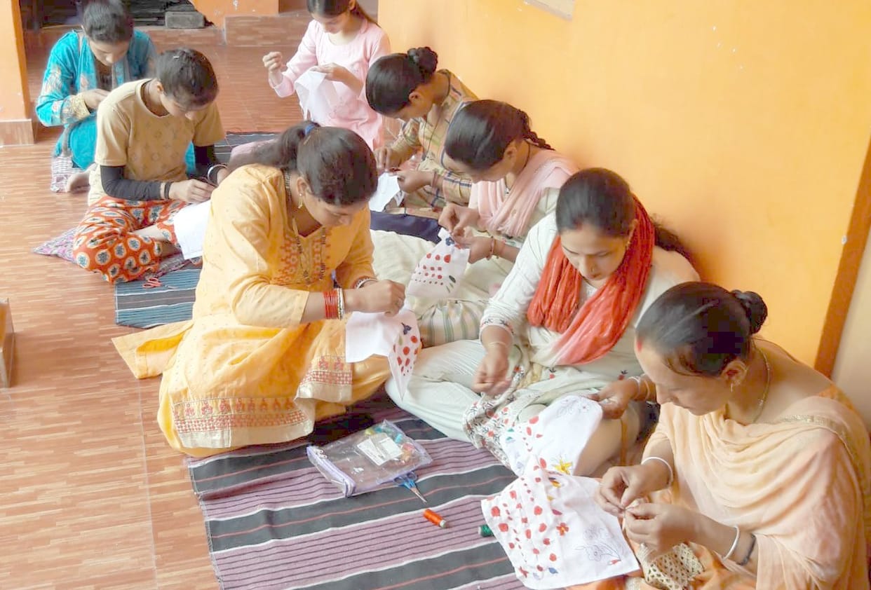 Girls from rural areas are learning to make Chamba handkerchief.