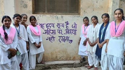 Girl students made people aware by writing on the wall