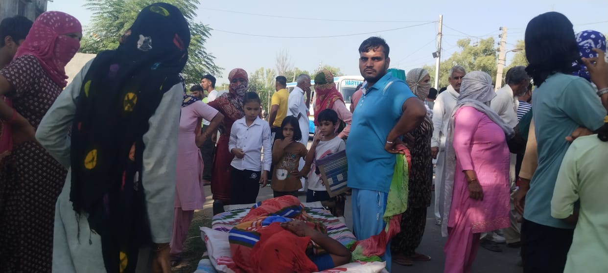 Villagers laid the injured woman on the road and blocked the road