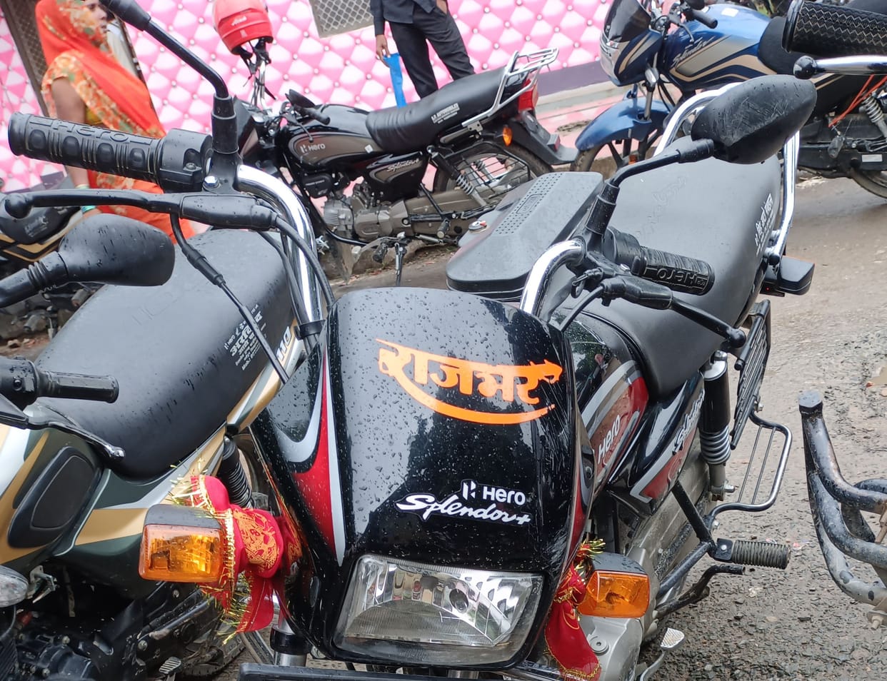 People driving with caste, religion and post written on vehicles