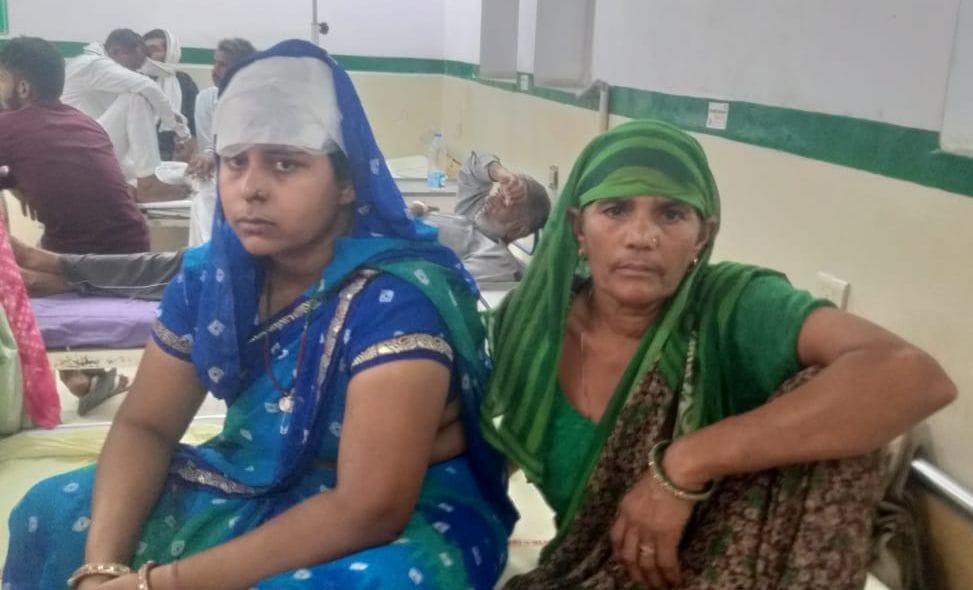A woman was attacked with a brick after entering her house, an employee included in the Dial 112 team that reached the spot was also injured.