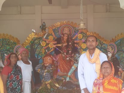 Devotees dance to the hymns in Durga Mahotsav