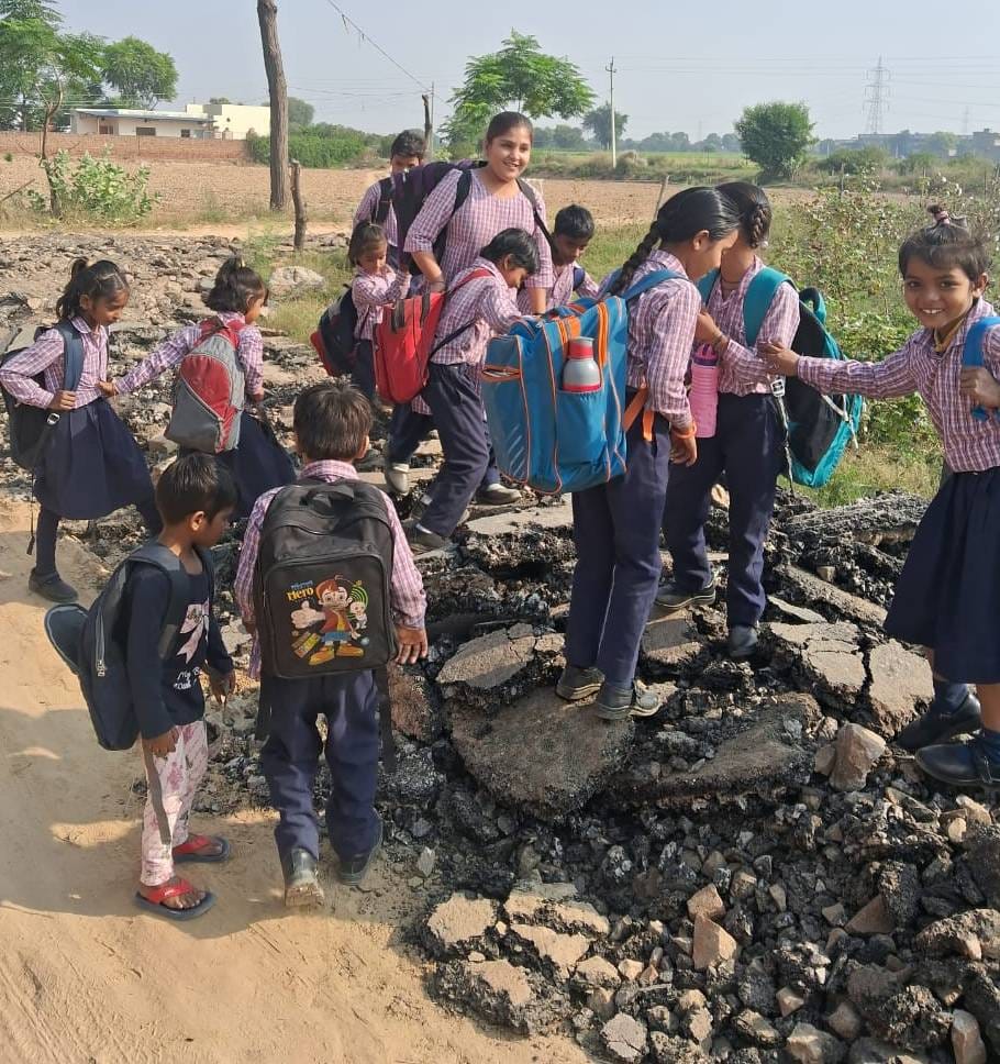 330 students reached school through fields and stones to shape their future.